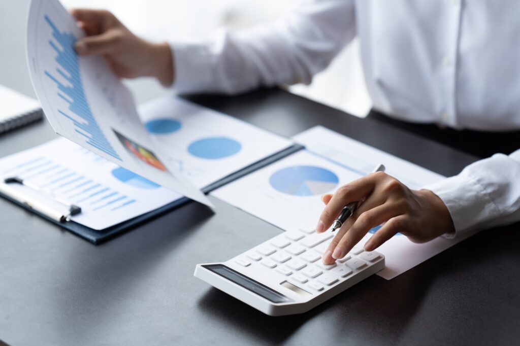 Businessman Accounting Calculating Cost Economic Financial data.